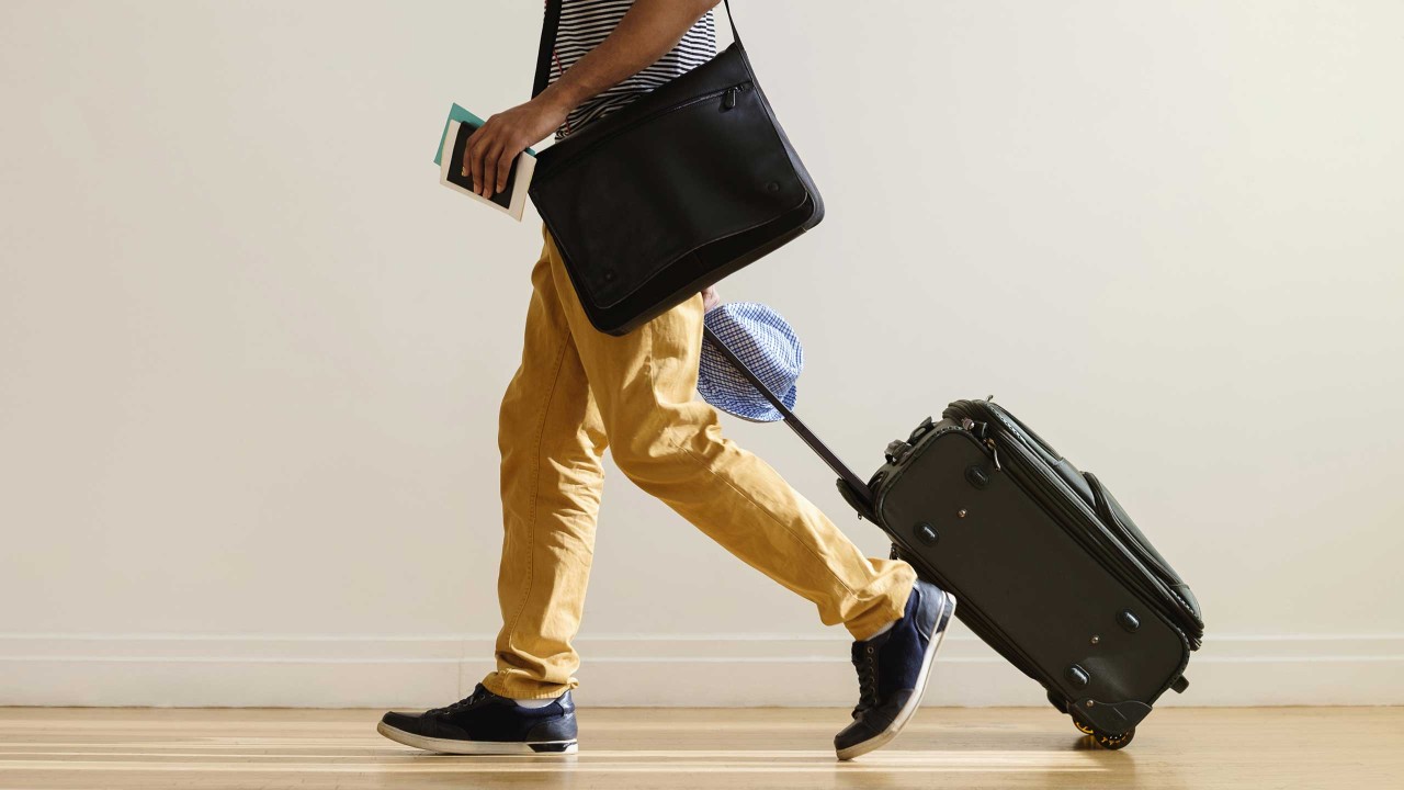 traveller wheeling luggage; image used for HSBC International Services Study abroad article Arriving at your destination