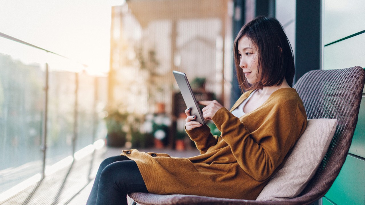 woman doing her banking on tablet